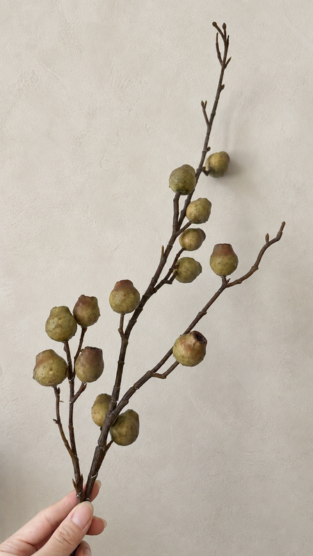 Antique Moss artificial berry branch close-up with earthy green berry texture