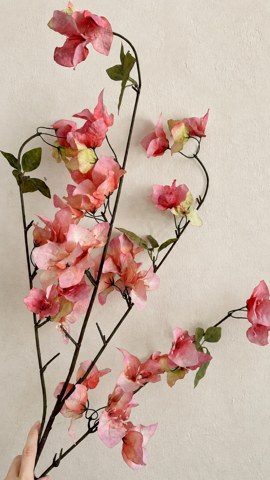 Full-length 37.4-inch Warm Coral Pink artificial bougainvillea branch held for scale