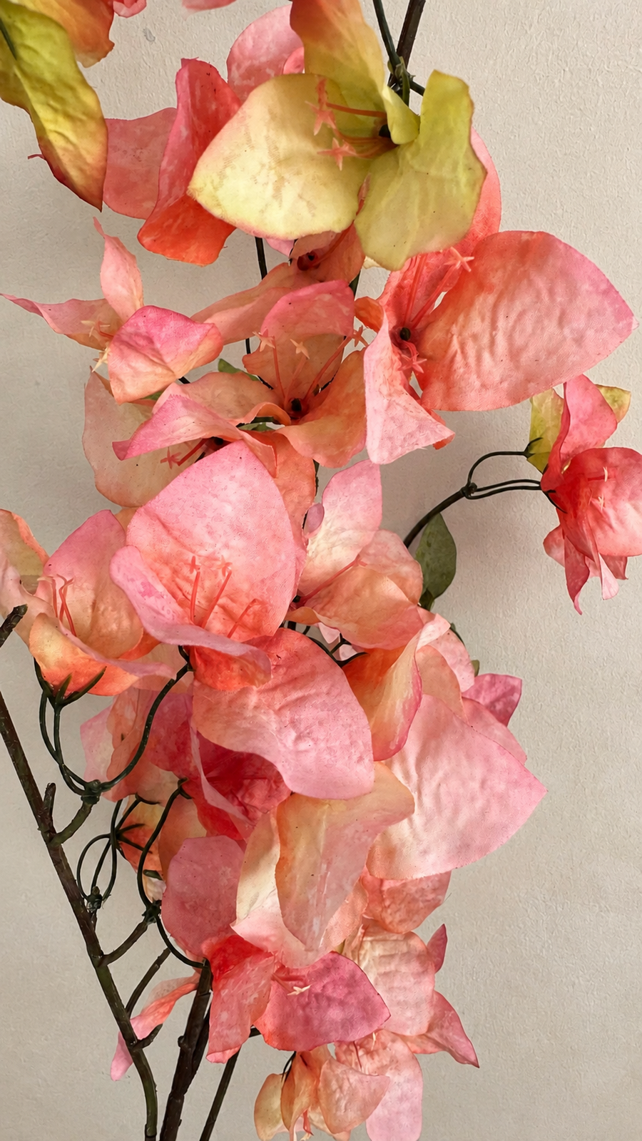 Warm Coral Pink faux bougainvillea petals with flexible branch and leaf detail