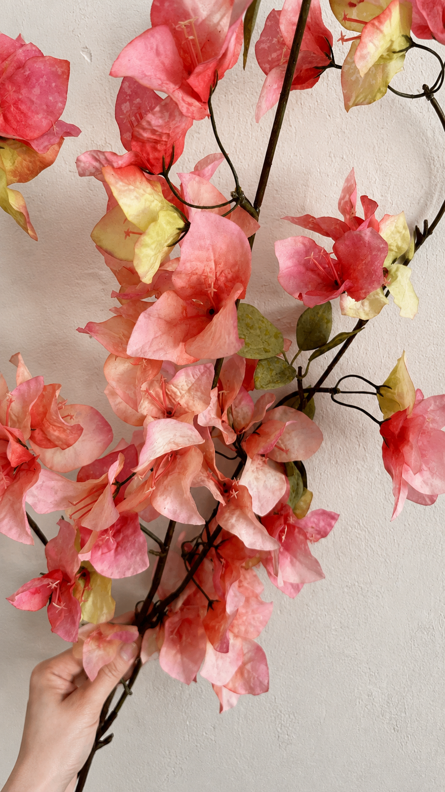 Warm Coral Pink artificial bougainvillea branches held together to show floral volume