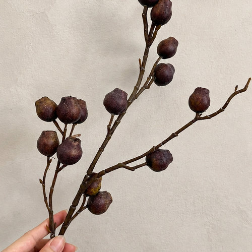 Deep Aubergine artificial berry branch close-up with textured berry clusters