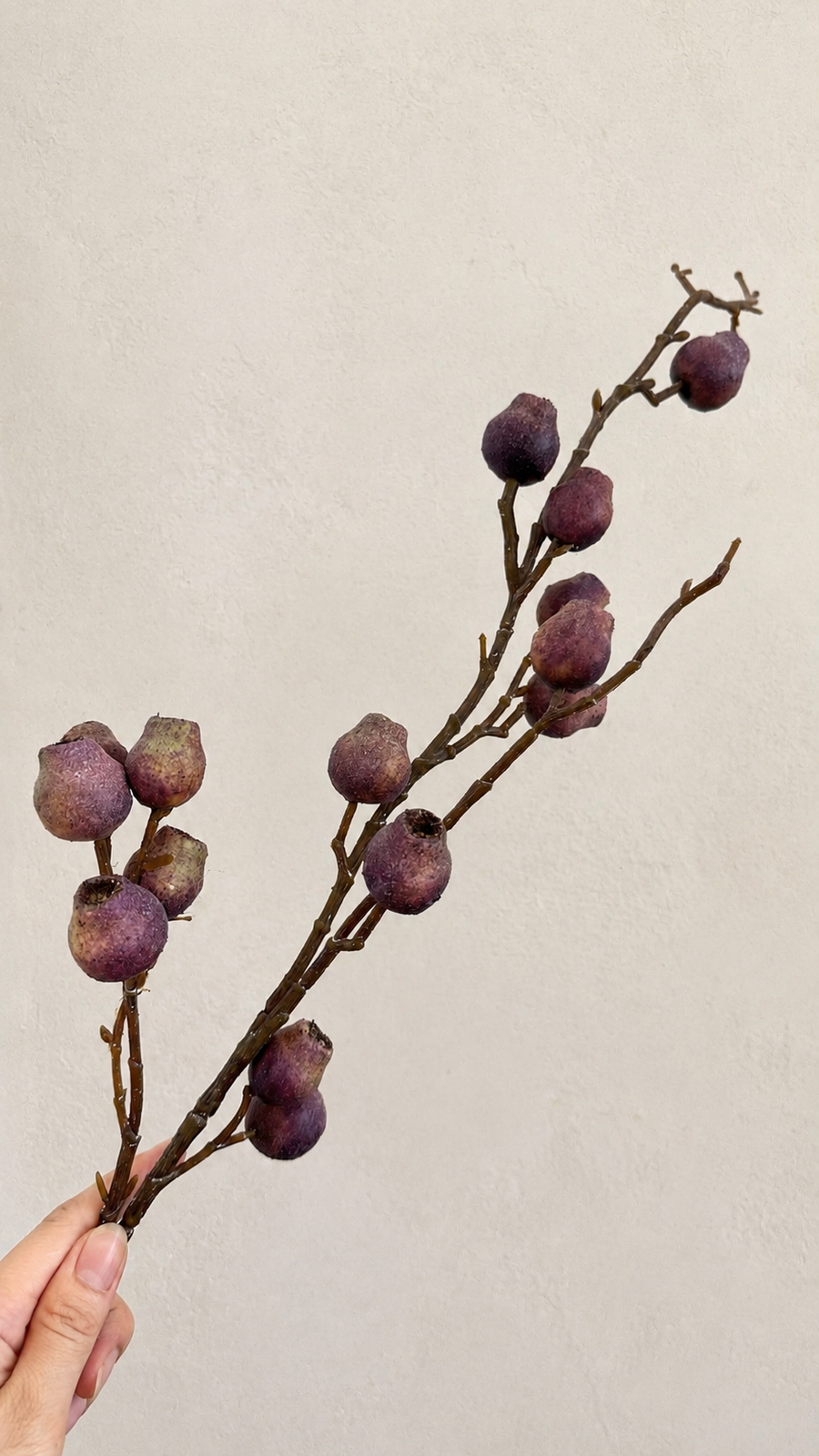 Dusty Plum artificial berry branch close-up with textured berry clusters