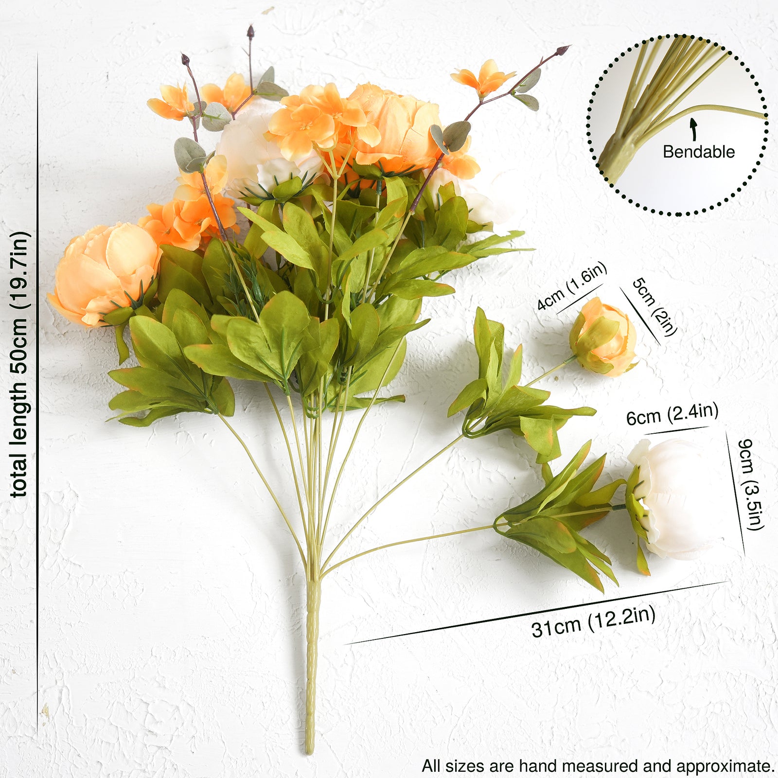 Artificial floral DIY kit with orange and white flowers, greenery, and tools for creating unique arrangements