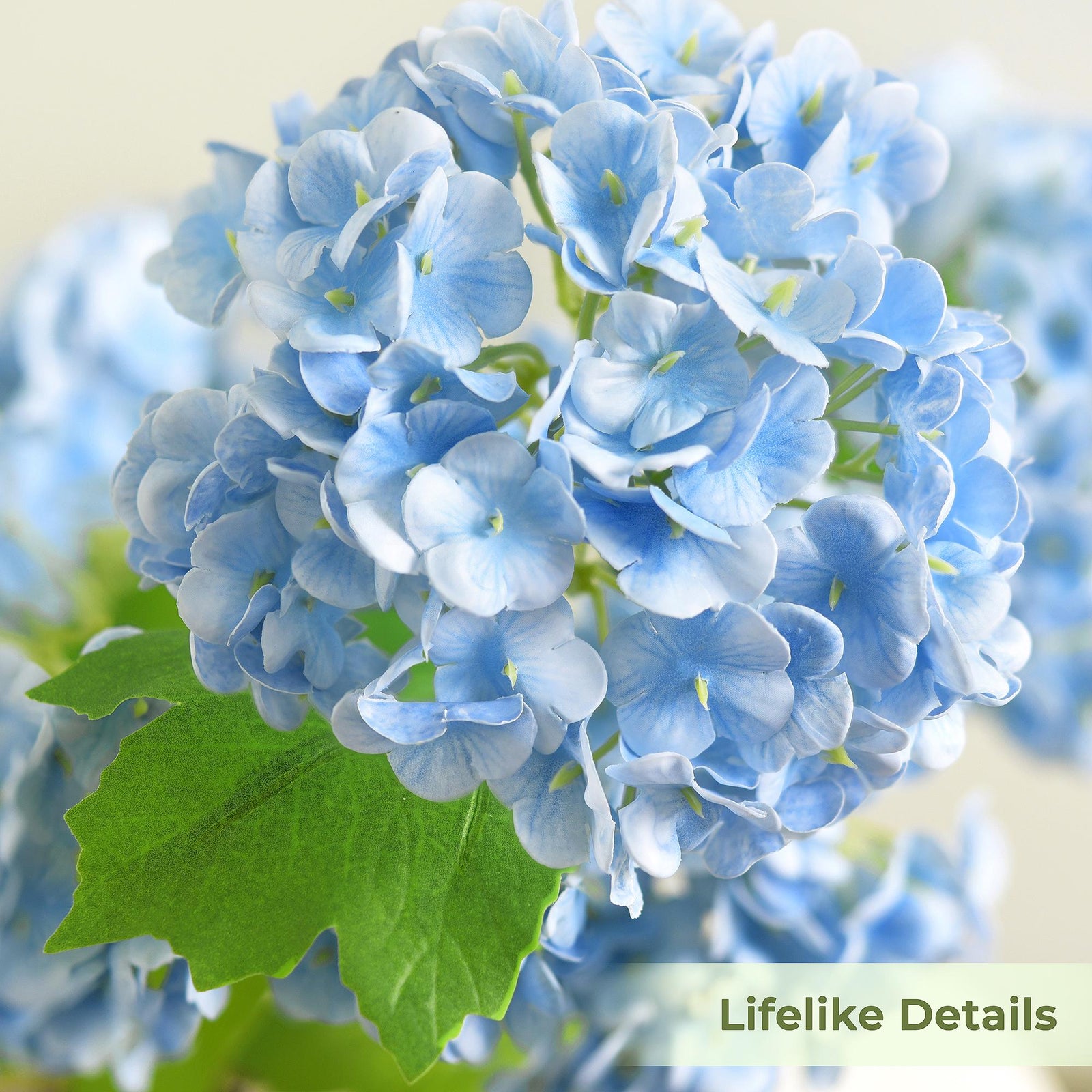 Close-up of blue hydrangea petals showing the soft real touch texture and clustered bloom detail.