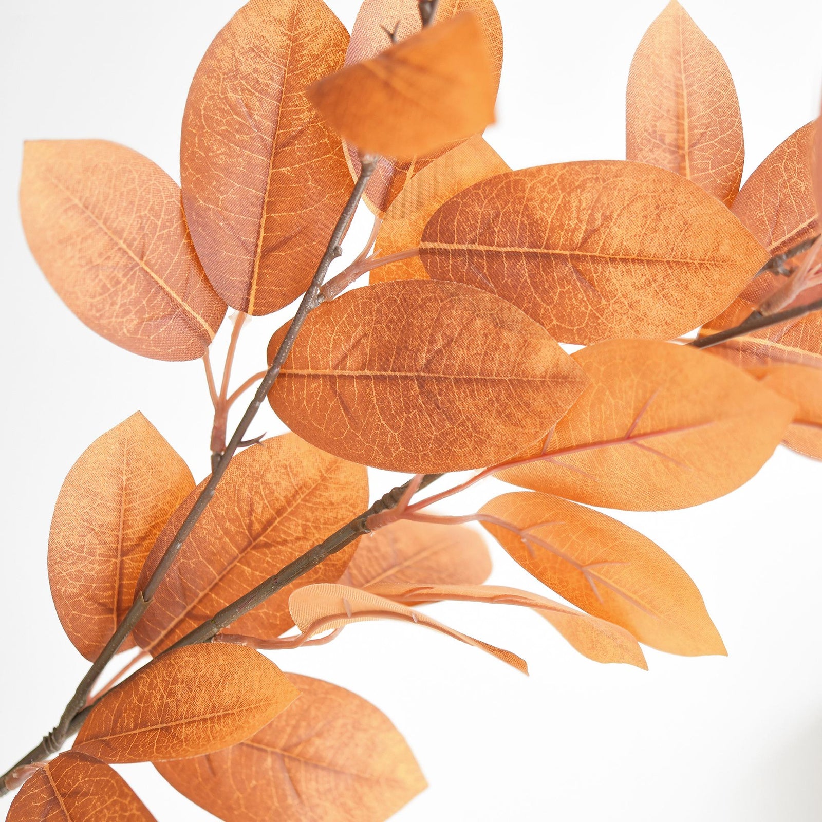Faux fall leaf branches showing the blush, gold and burnt orange color mix.