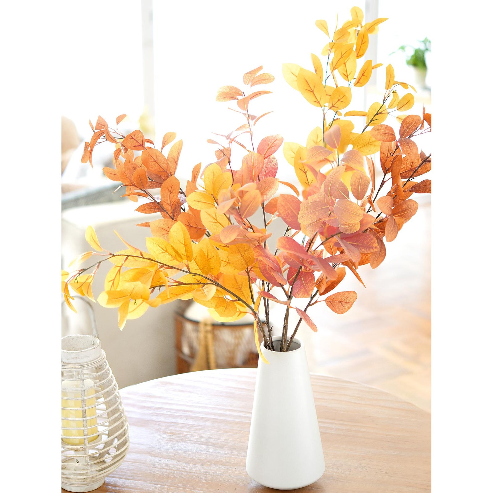 Detail view of blush pink, golden yellow and burnt orange artificial fall foliage.