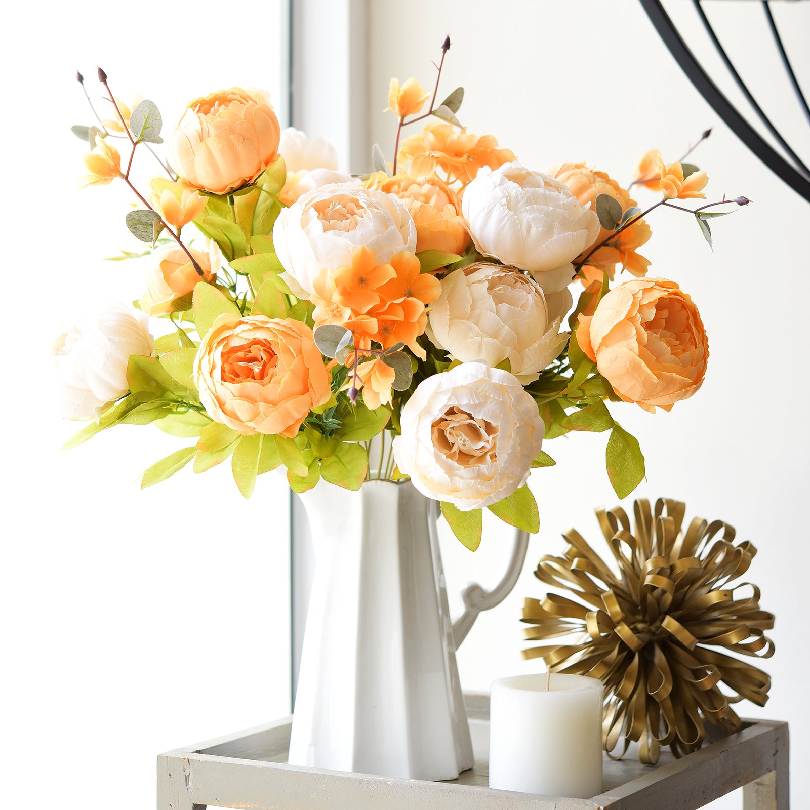 Elegant orange peony and daisy centerpiece in a modern white vase, great for dining tables or office decoration
