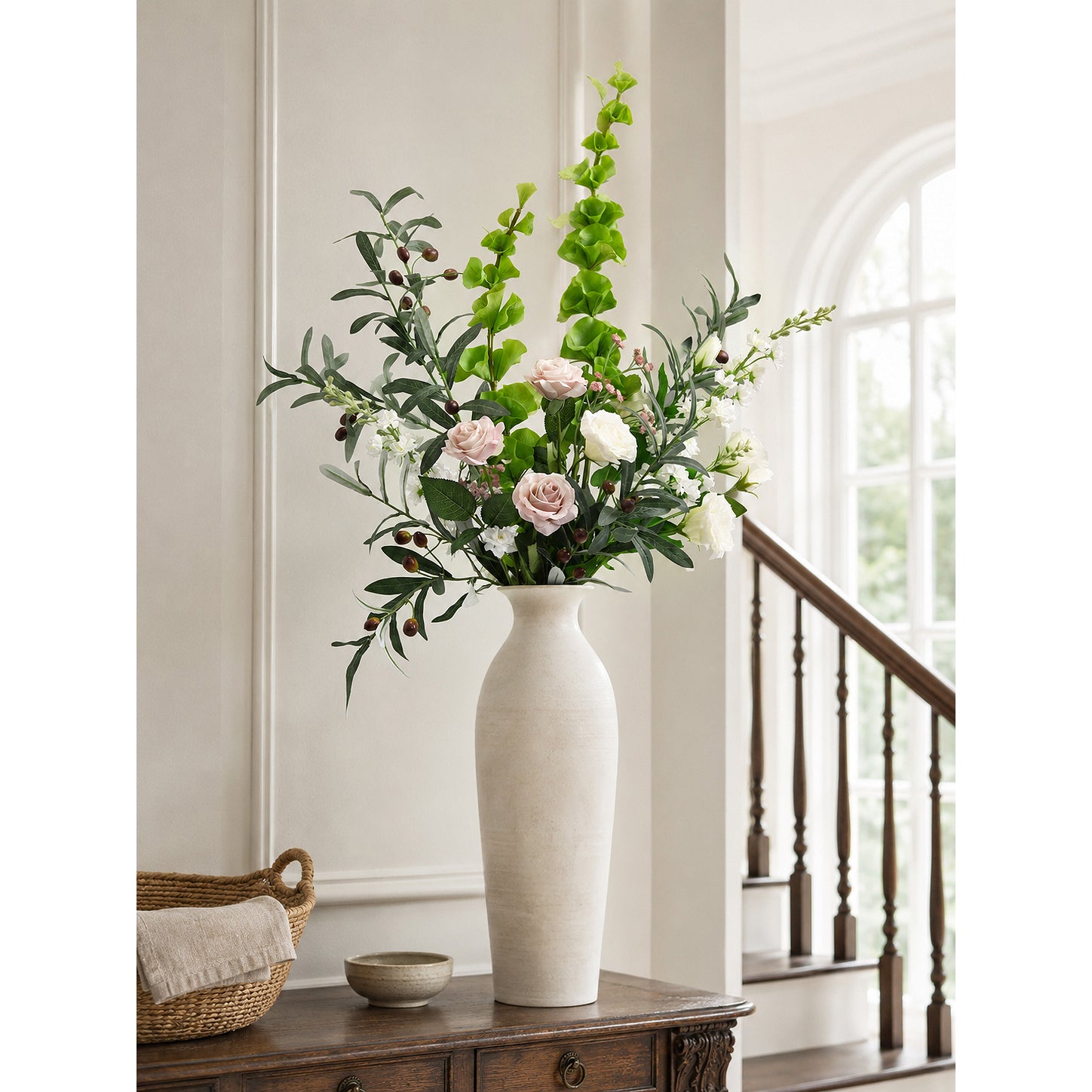 Green faux Bells of Ireland stems with clustered bell-shaped blooms.