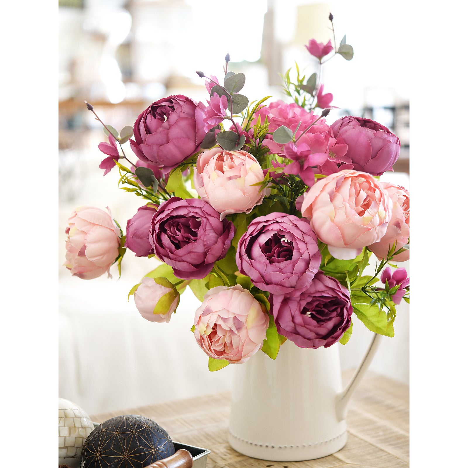 Luxurious pink and purple peony bouquet in a ceramic vase, ideal for adding a touch of elegance to any space.