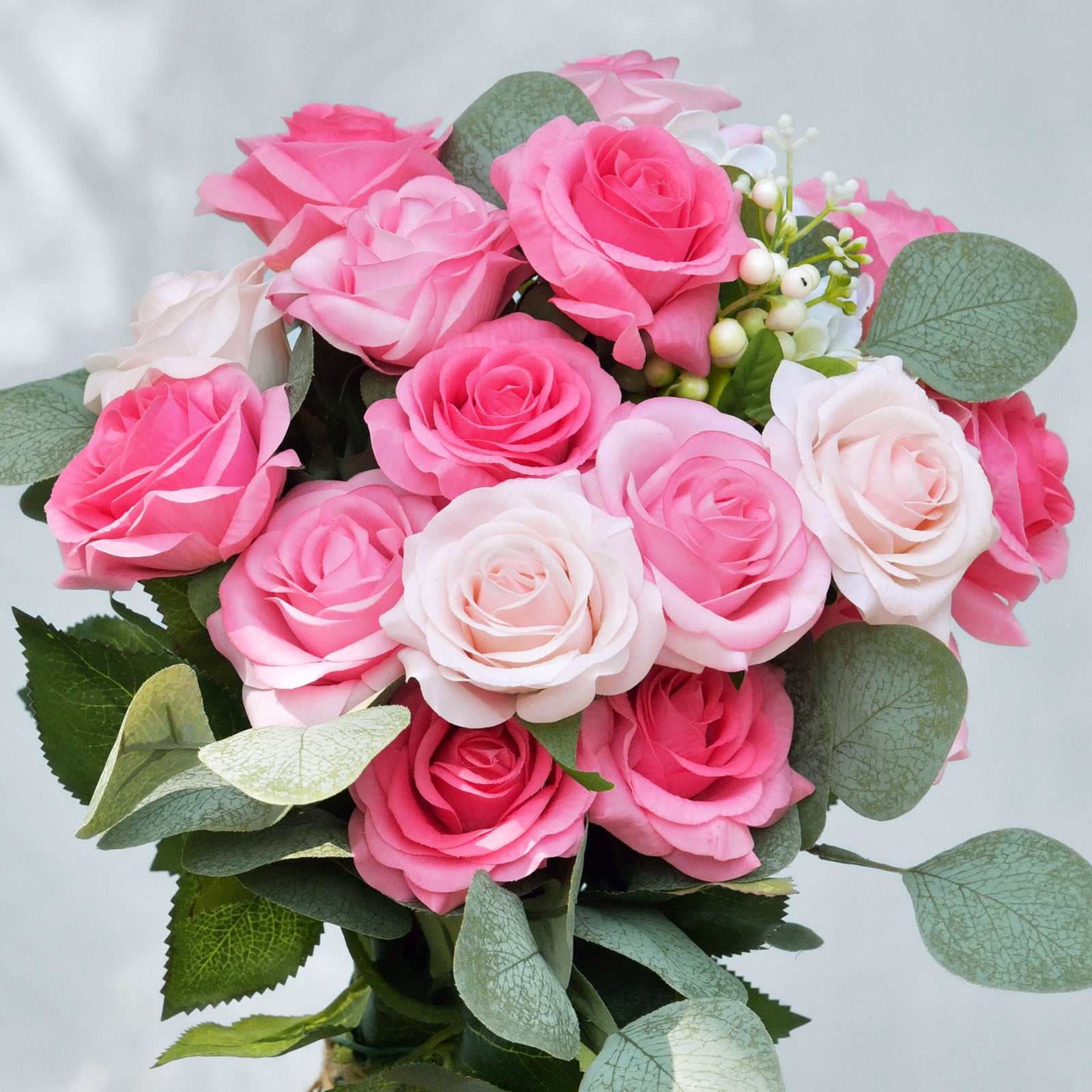 Magenta pink artificial rose stems shown in a full product view.