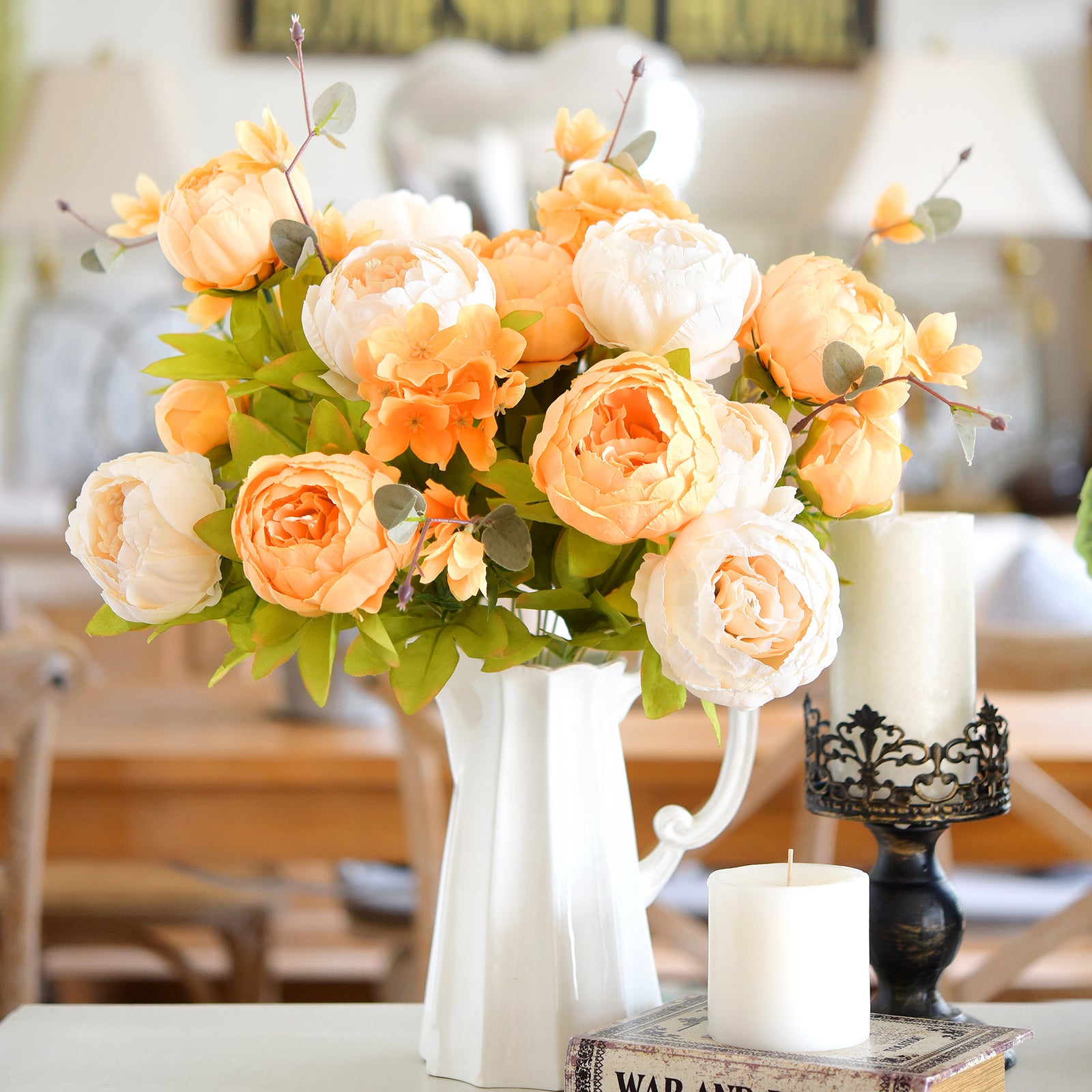 Multicolor floral display featuring peonies in orange, pink, and cream, arranged in a ribbed ceramic vase for modern home styling