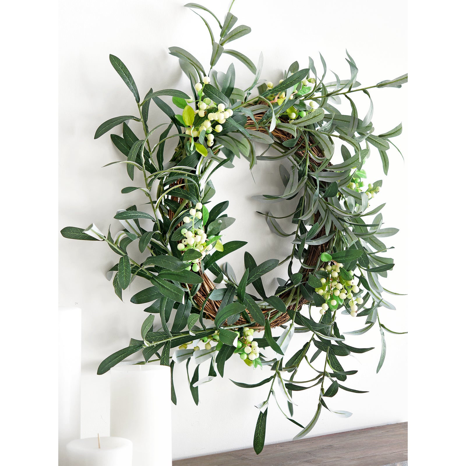 Artificial olive branches arranged into a lush wreath with realistic leaves and small olives, perfect for door or wall decoration