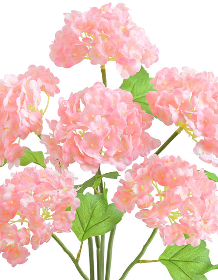 Six pink real touch hydrangea stems with rounded blooms and green leaves on a white background.