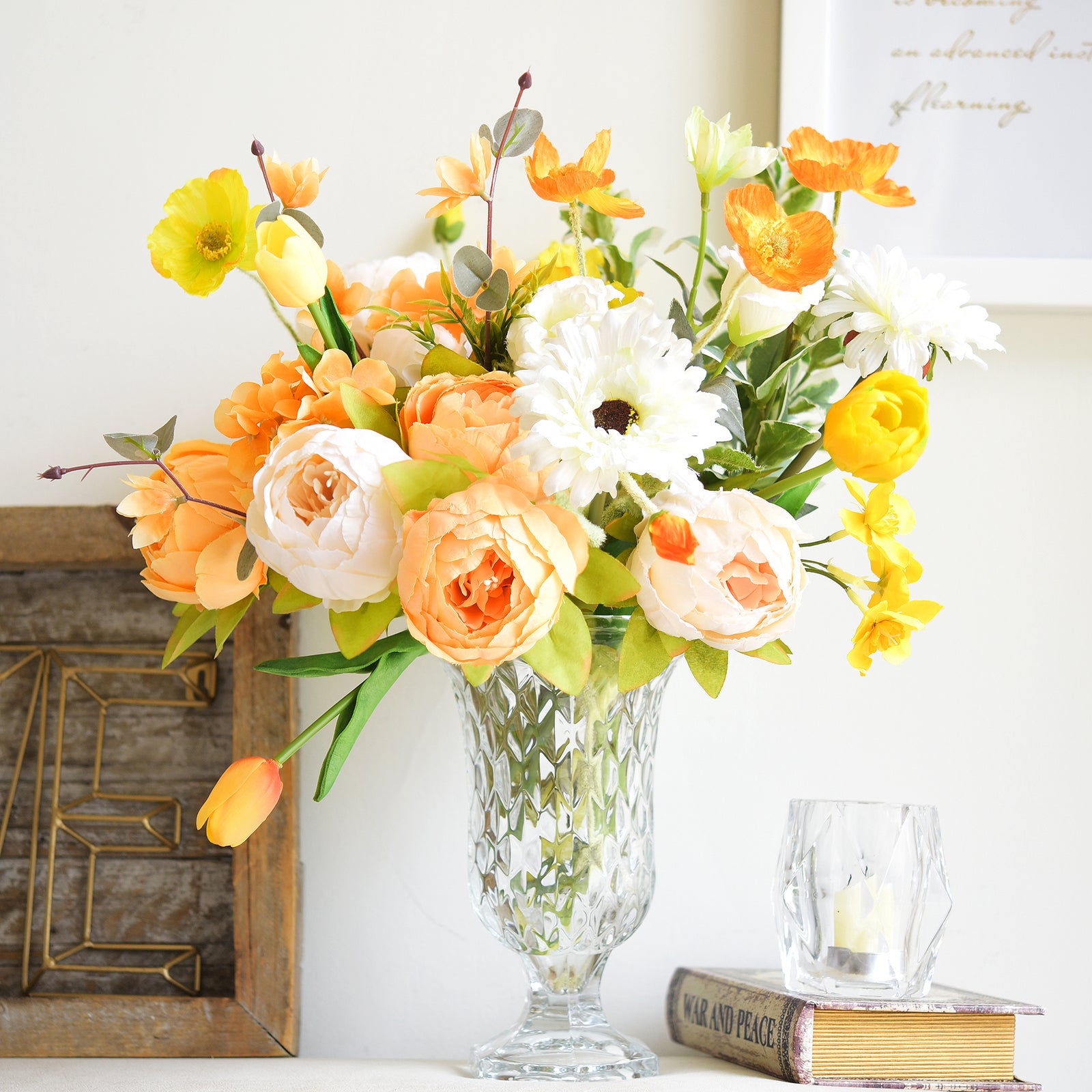 Bright orange and yellow peony bouquet with white daisies in a crystal vase, perfect for spring and summer décor.