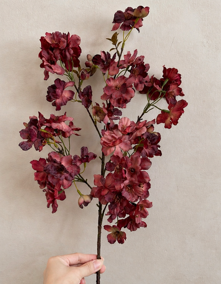 Full-length 37.4-inch wine burgundy artificial cherry blossom branch held for scale