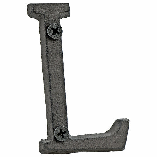 A cast iron house letter sign ‘L’ with white background 