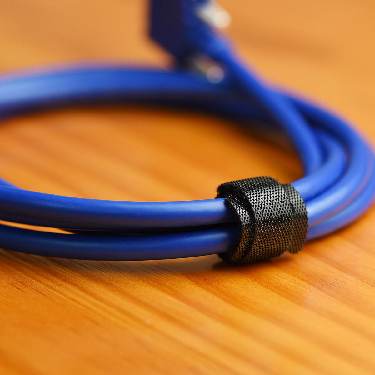 Black reusable nylon hook and loop cable ties shown in product view 5 for cord and wire organization.