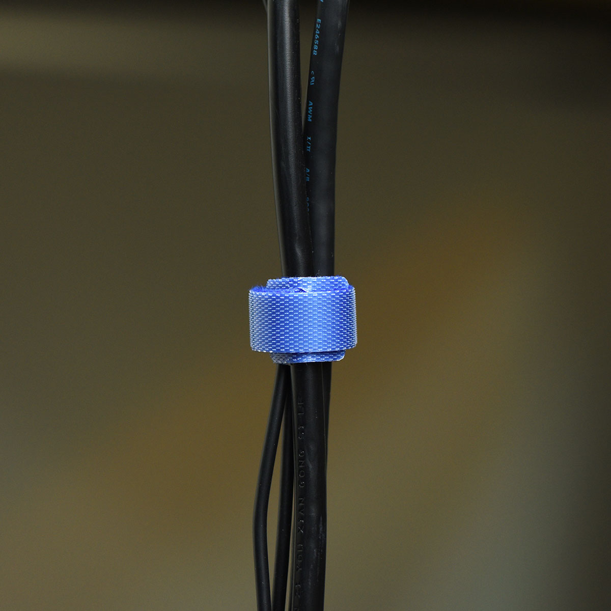 Blue reusable nylon hook and loop cable ties shown in product view 5 for cord and wire organization.