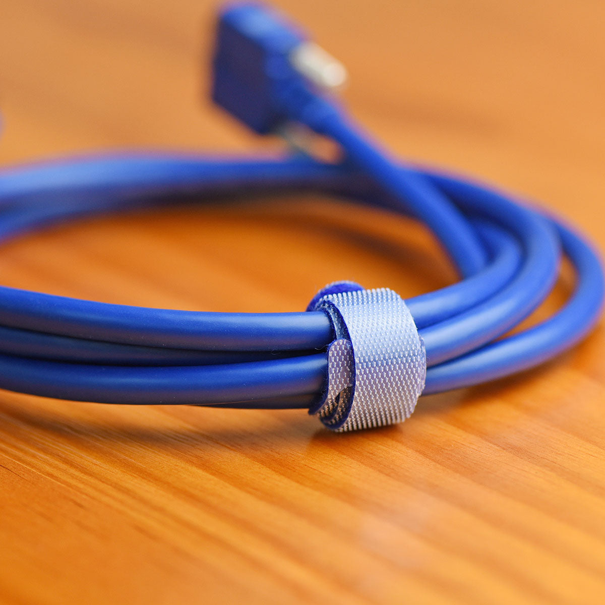 Blue reusable nylon hook and loop cable ties shown in product view 6 for cord and wire organization.
