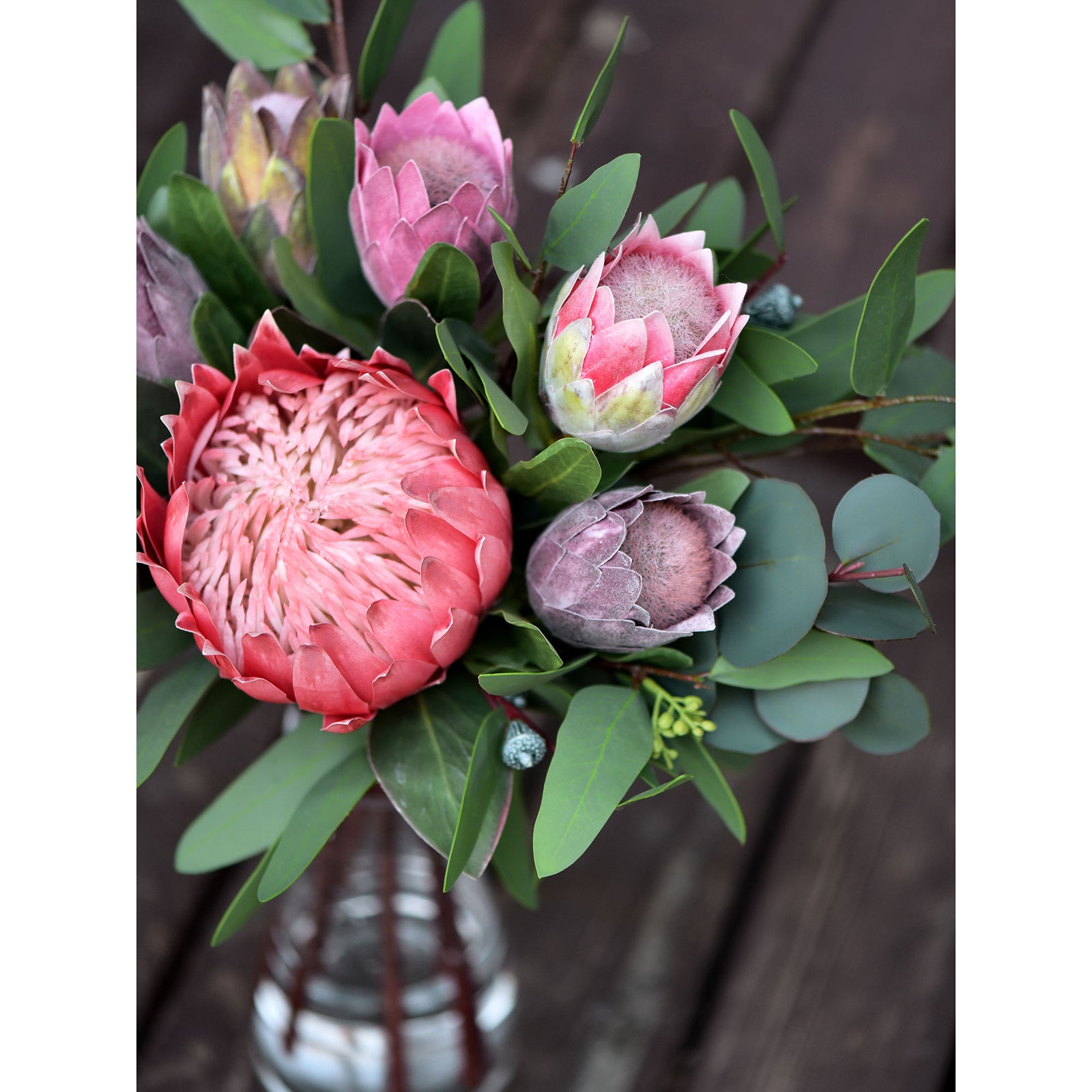 Dusty plum artificial baby protea flowers shown in an alternate product view.