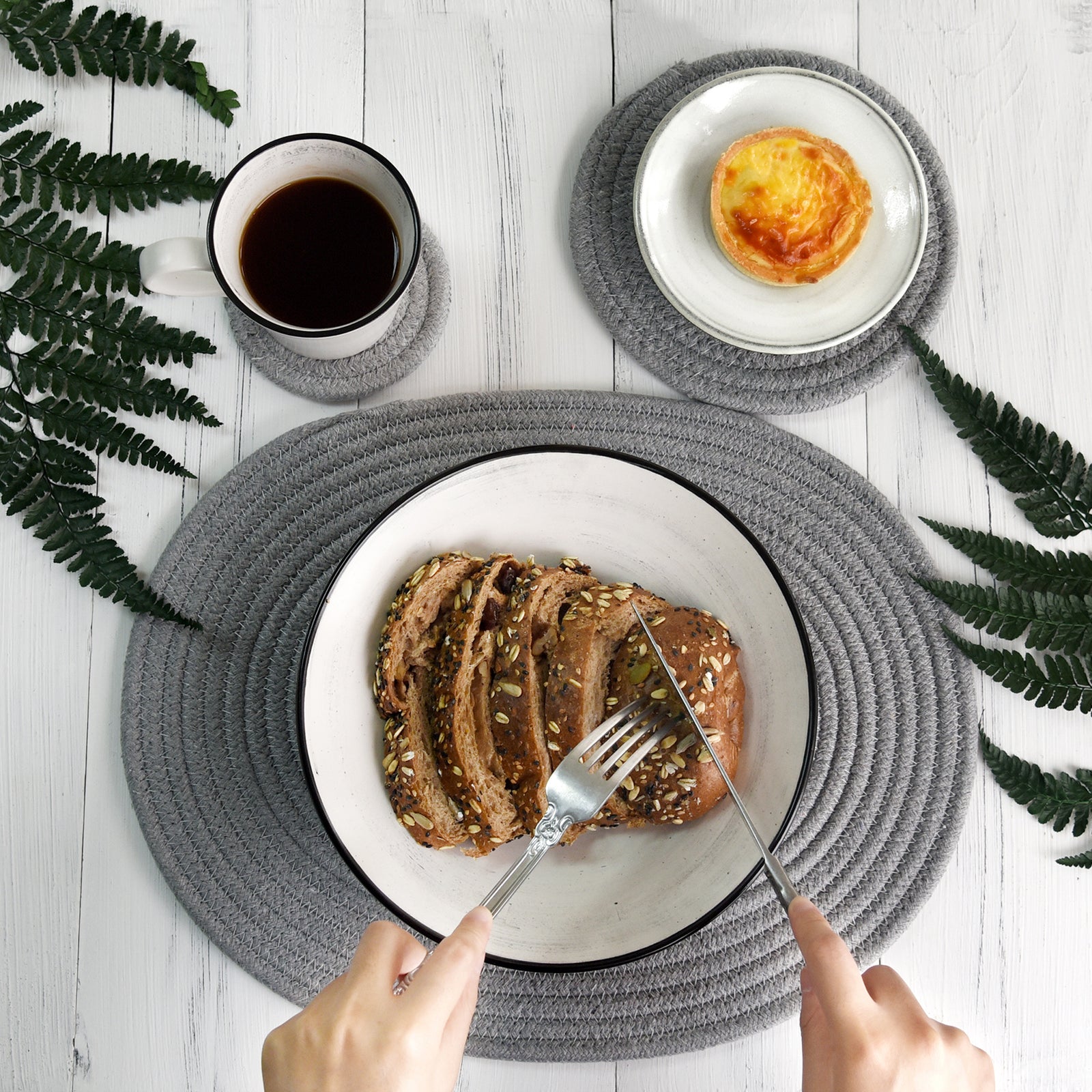 Gray woven cotton placemat set shown in an additional tabletop product view.