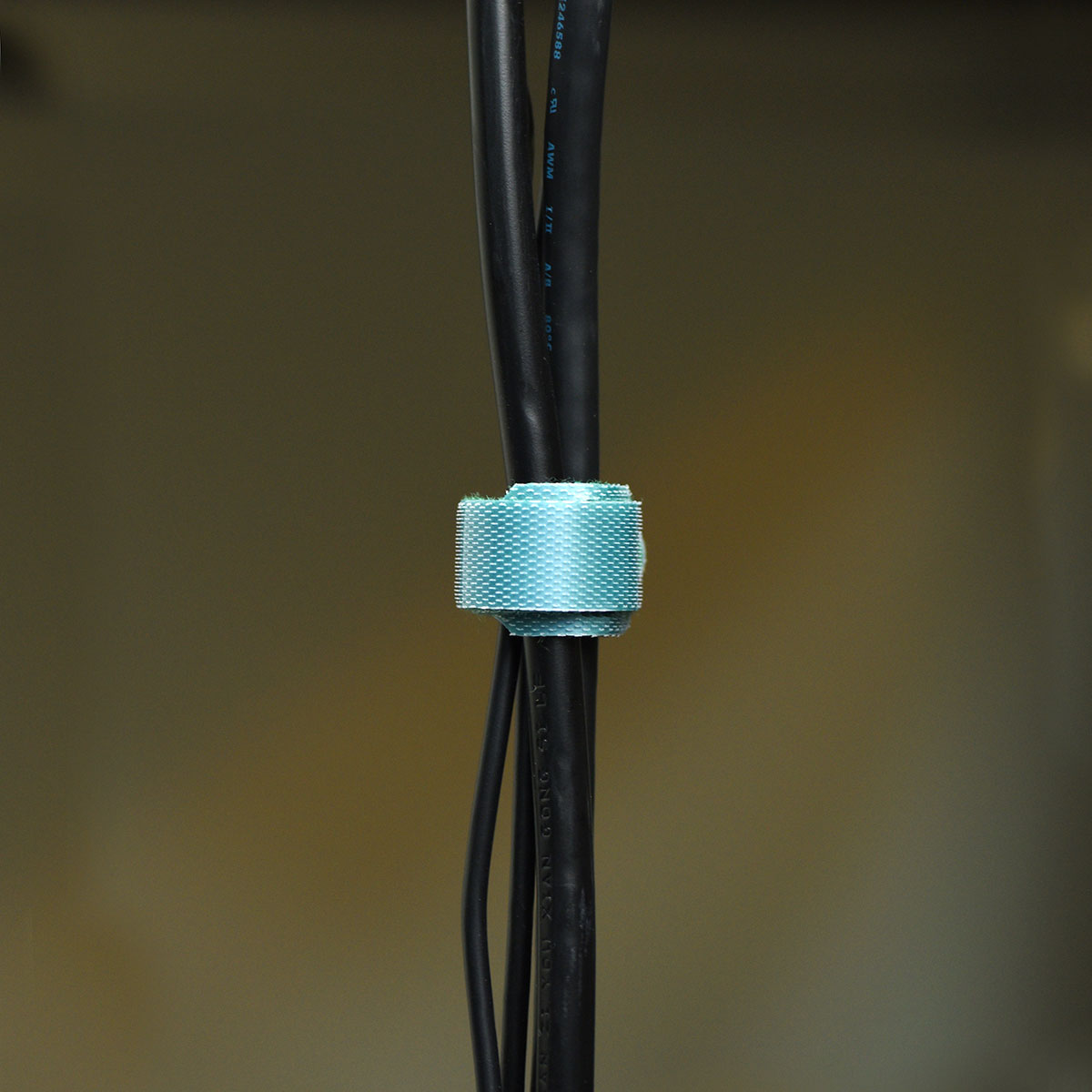 Green reusable nylon hook and loop cable ties shown in product view 5 for cord and wire organization.