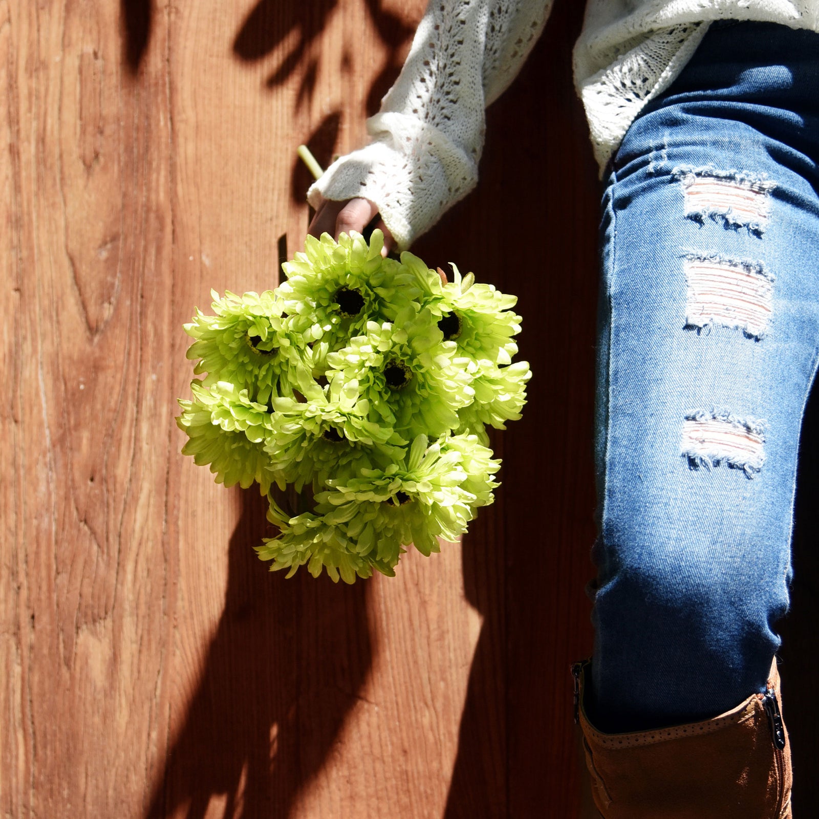Green artificial gerbera flower stems shown in an additional arrangement view.