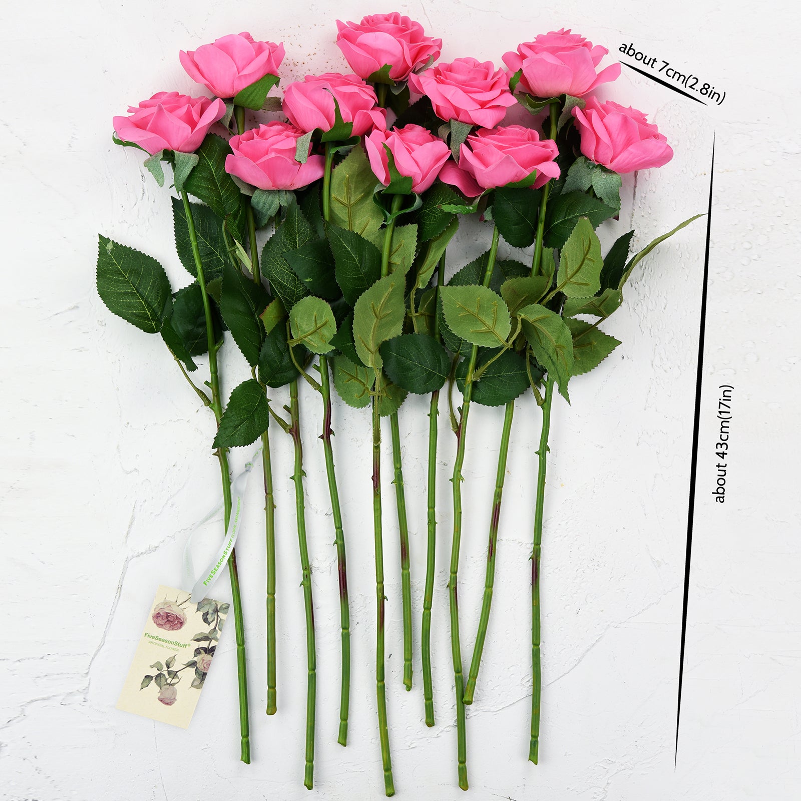 Magenta pink Real Touch rose stems shown for bouquet and vase arrangement styling.
