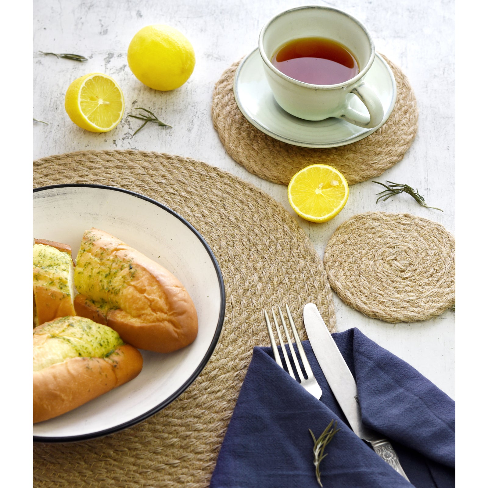 Three-piece jute table mat set shown in an additional dining and decor styling view.