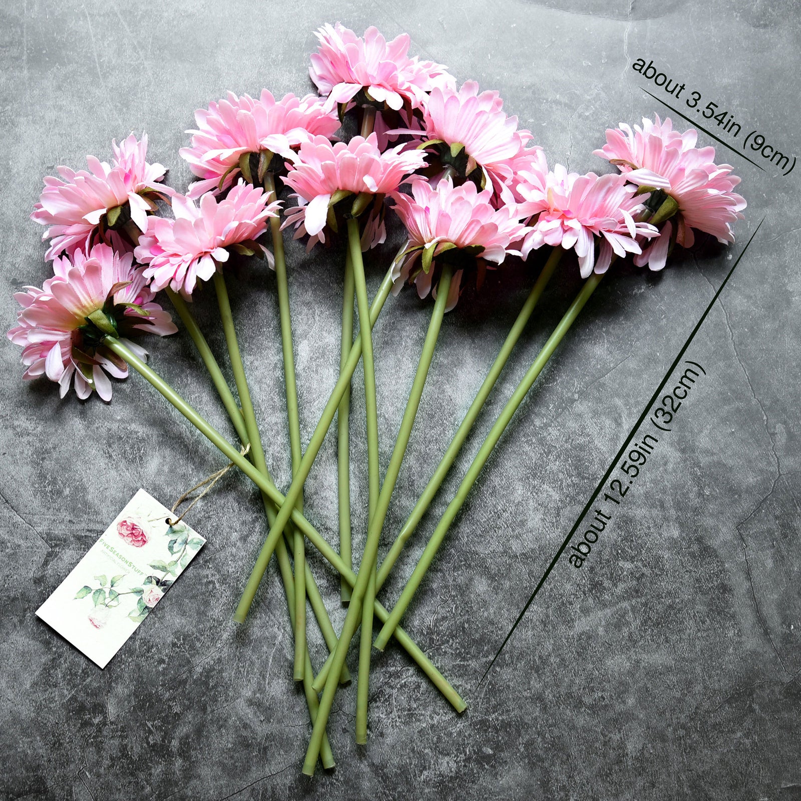 Pink silk gerbera stems shown in an alternate product and bouquet view.