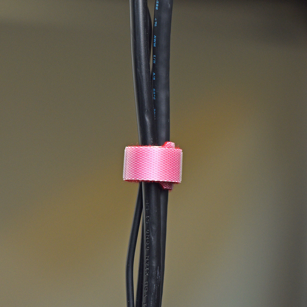 Red reusable nylon hook and loop cable ties shown in product view 5 for cord and wire organization.
