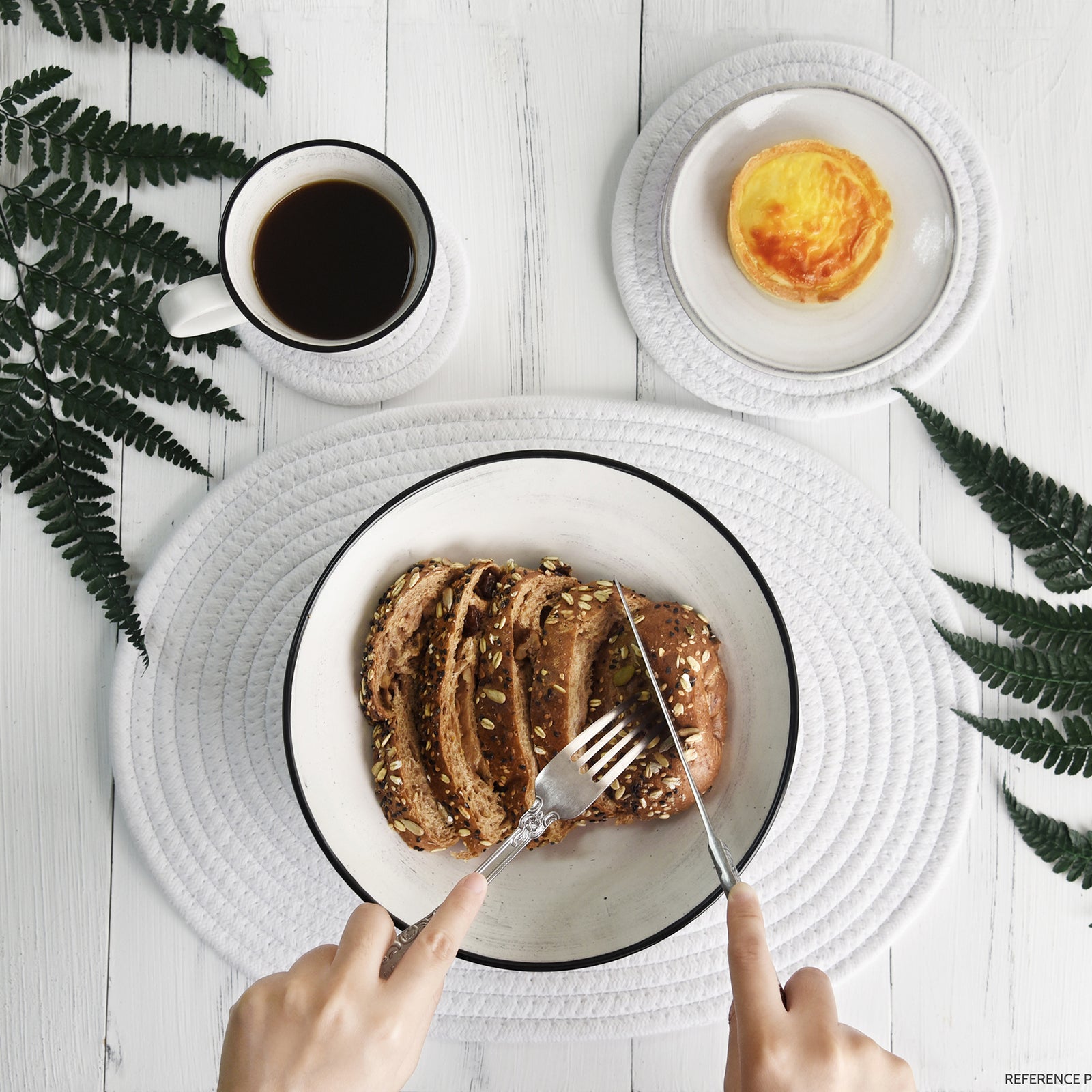 White woven cotton placemat set shown in an additional tabletop product view.