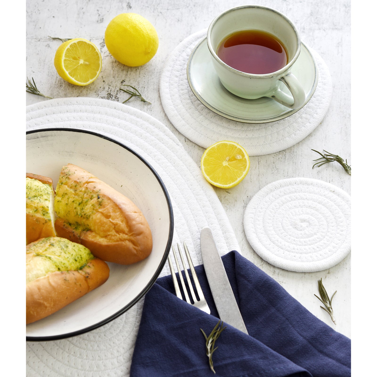 White cotton table mat set shown in an additional dining and decor styling view.